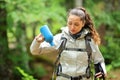 Trekker worried with empty water bottle Royalty Free Stock Photo