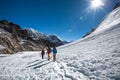 Trekkers crossing Gokyo glacier in Khumbu valley on a way to Eve Royalty Free Stock Photo