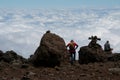 Trekkers gazing over the clouds