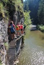 Trekkers on metal ladder in Canyon Prielom Hornadu in SlovenskÃÂ½ raj Slovak Paradise National Park Royalty Free Stock Photo