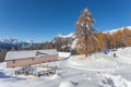 Trekkers near alpine hut in front of an awesome winter scenery, Dolomites Royalty Free Stock Photo