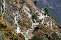 Trekkers walk to village at Himalayas trail on the way to Everest base camp. Royalty Free Stock Photo