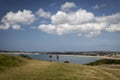 Trekkers walking along the coast at weymouth