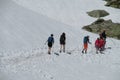 Trekkers walking on a hike to the snow mountains Royalty Free Stock Photo