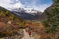 Trekkers walking to Samagaun village in Manaslu circuit trekking route in autumn season, Himalaya mountains range in Nepal