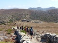 Trekkers in the wild nature inland Amorgos in Greece. Royalty Free Stock Photo