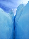 Glacier crack background under blue sky. Trekking, adventure and extreme nature Royalty Free Stock Photo