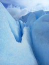 Glacier crack background under blue sky. Trekking, adventure and extreme nature Royalty Free Stock Photo