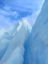 Glacier crack background under blue sky. Trekking, adventure and extreme nature Royalty Free Stock Photo