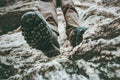 Trekking boots feet traveler climbing at rocky mountains Travel Lifestyle