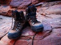 Trekking boots on red rocks