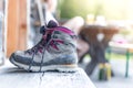 Trekking boots on the veranda of an alpine hut. Summer holidays in the mountains