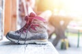 Trekking boots on the veranda of an alpine hut. Summer holidays in the mountains