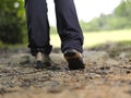 Trekking boots walking away Royalty Free Stock Photo