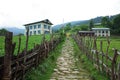 Trekking in Nepal Himalayas. Stone paved walkway throu Ringmu village