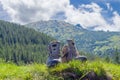 Trekking shoes on blurred background of forested mountains and s Royalty Free Stock Photo