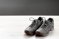 Trekking sneakers with red sole, gray copy-space background Royalty Free Stock Photo