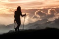 Trekking in solitude among the mountains. Silhouette of a girl