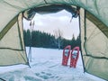 Trekking tent built against snowy landscape. Winter skialpinism trek over snowy mountain peaks Royalty Free Stock Photo