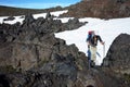 Trekking Villarrica traverse hiking trail, Solidified lava field with snow in Villarrica national park