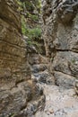 Trekking on a winding path through Imbros gorge near Chora Sfakion, island of Crete Royalty Free Stock Photo