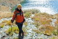 Trekking woman portrait. Autumn mountain road landscape. Adventure solo tourism isolation concept. New modern nomad Royalty Free Stock Photo