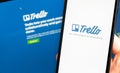 Trello logo app on the screen smartphone and notebook closeup Royalty Free Stock Photo