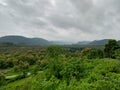 Tremendous green valley view with foggy mountains in the background in monsoon season at Central India