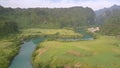 Tremendous hills with thick forests reflected in calm river