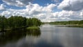 Tremendous river separates green dense forests aerial view