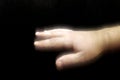 Tremor or strong and painful hand shake on a black background Royalty Free Stock Photo