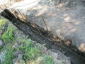 Trench under the foundation for the construction of the fence. Close-up from above. Royalty Free Stock Photo