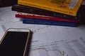 Trend chart of stock market and books on desk