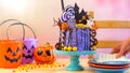 On trend Halloween candyland novelty drip cake in colourful party setting. Royalty Free Stock Photo