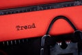 Trend. Text written on a red paper made by old typewriter