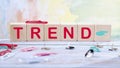 Trend text written on wooden cubes on a light colored background Business, trend or megatrend concept
