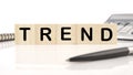 Trend a word written on wooden cubes on a white background. Business, trend or megatrend concept Royalty Free Stock Photo