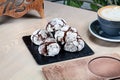 Close up view on homemade chocolate cookies on black chalkboard with coffee. Royalty Free Stock Photo