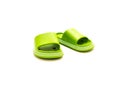 A trending cute pair of green open toe pillow slide sandals for toddler non-slip foam slippers isolated on white Royalty Free Stock Photo