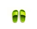 A trending cute pair of green open toe pillow slide sandals for toddler non-slip foam slippers isolated on white Royalty Free Stock Photo