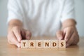 Trends concept. The word TRENDS on wooden cube block Royalty Free Stock Photo