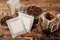 Drip bag of fresh drink in a glass with coffee beans on background. Royalty Free Stock Photo