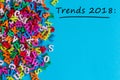 Trends 2018 - text at blue background with many little letters and empty space for text, mock up. New trend, fashion