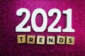 Trends 2021 word alphabet letters on pink glitter background