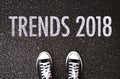 Trends 2018 wording on road with shoes. Royalty Free Stock Photo