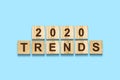 2020. Trends. Words on wooden blocks. Isolated on a blue background. Business. Royalty Free Stock Photo