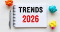 Trends 2026 written on a notebook with crumpled paper balls and pen Royalty Free Stock Photo