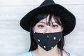 Trendy asian girl wearing protective face mask during coronavirus outbreak - Portrait of young chinese woman during Covid-19