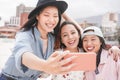 Trendy asian girls making video story for social network app outdoor - Young women friends having fun taking selfie - New
