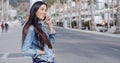 Trendy attractive young woman in a denim outfit